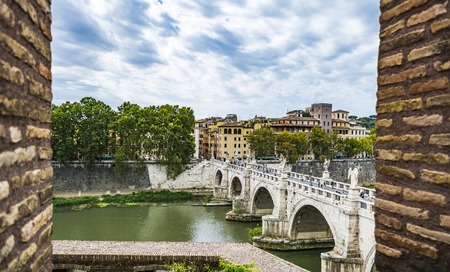 View of people walk on St Angel Bridge from Castel SantAngelo in Rome cityの写真素材