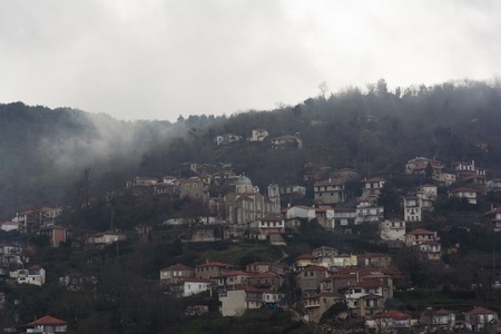 Image of village in the mountains with fog, Arcadia, Greeceの写真素材