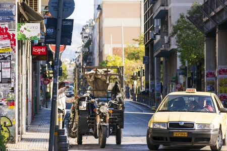 Athens, Greece - October 13, 2019: A old red tricycle on the street of Athens.のeditorial素材
