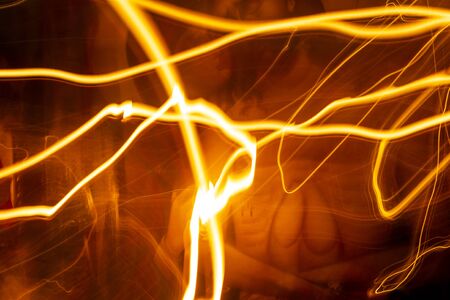 Abstract Light painting with candle light in church - blurred lights background.の写真素材