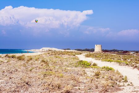 Agios Ioannis beach in Lefkas island Greece. Colorful power kites span across the sky from kite-surfers.の写真素材