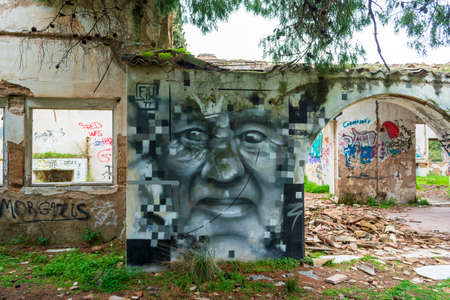 Abstract face wall painting at an abandoned old villa at Pallini, Greeceのeditorial素材