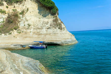 Corfu island, Greece - August 21 2018: Rocky beach in Corfu Island, Greece