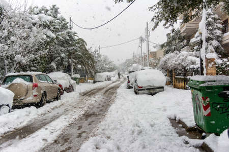 ATHENS, GREECE - February 16 2021: Cars totally covered with snow in Vrilissia district, during snow storm in Athens city, capital of Greece, Europeのeditorial素材