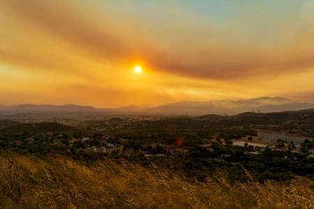 Athens view at sunset with red and yellow clouds from Penteli mountain.の写真素材