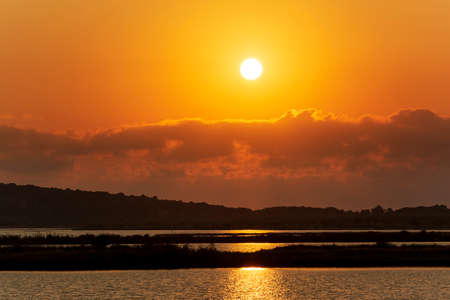 Sunset at the gialova lagoon. The gialova lagoon is one of the most important wetlands in Europe, as it constitutes the southernmost migratory station of migratory birds in the Balkans to and from Africa.の写真素材