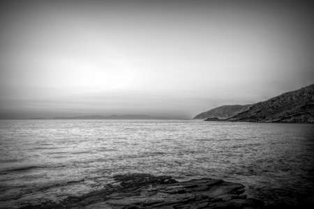Dramatic seascape behind Kythera island. Natural beauty in an idyllic Greek island. Black and white photo.の写真素材