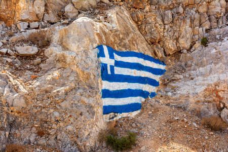 Flag of Greece painted on a rock. Kythira, Greece.の写真素材
