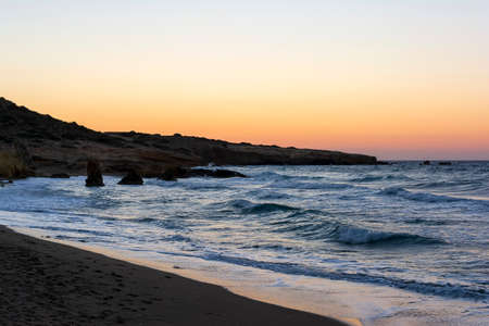 Beautiful sunset at a beach of the Milos islandの写真素材