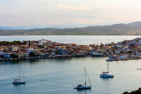Beautiful view of Ermioni sea lagoon with moored yachts and boats at sunset time. Travel by Greece.の写真素材