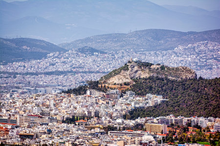Panorama of Athens, view of Lycabettus Mount from Hymettus Mountain. Cityscape of Athens with old and modern Greek houses. Travel concept.の写真素材