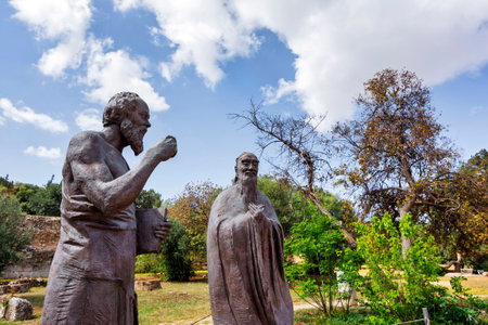 Statues of Socrates and Confucius at the ancient Agora of Athens. The Monument is situated west side of the Roman Agora, in Athens, Greece.の写真素材