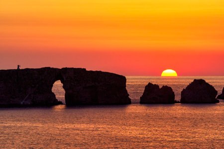 Sunset at the island of Sfaktiria near the town of Pylos in Peloponnese, Greece.の写真素材