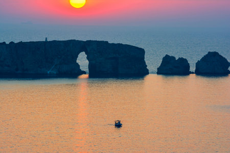 Sunset at the island of Sfaktiria near the town of Pylos in Peloponnese, Greece.の写真素材