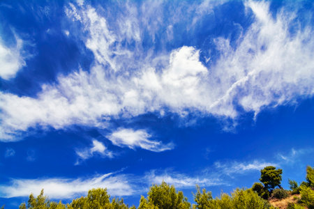 Blue sky with white clouds. Greece.の写真素材