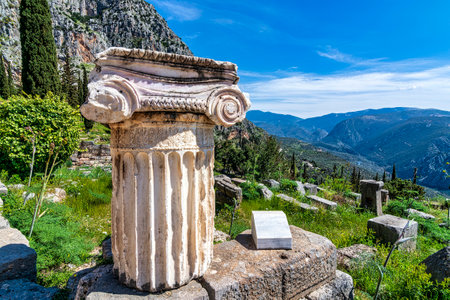 Ancient Greek column at the Delphi archaeological site. Delphi was considered the center of the...