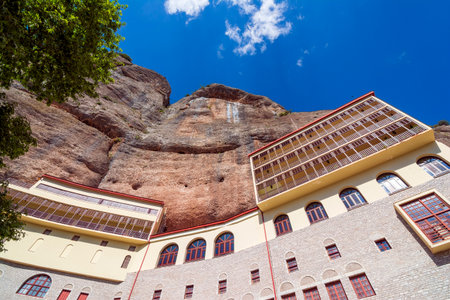 View of the Monastery Of Mega Spilaio in Kalavryta, Greece. The monastery is located in a large cave...