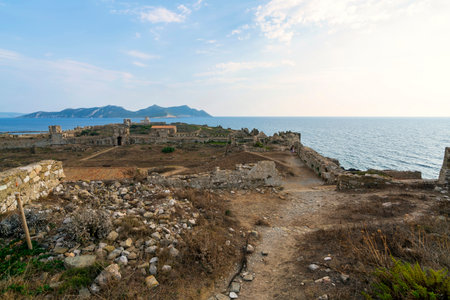 A panoramic view of Methoni Fortress, featuring the vaulted cistern, Church of Agios Nikolaos, and Sapientza Island in the background.の写真素材