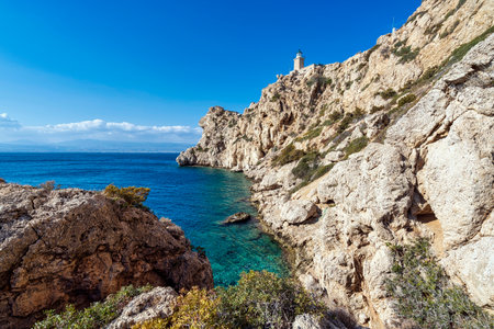 Lighthouse Melagavi, also known as Heraion Lighthouse, stands on a rugged cliff above the Corinthian Gulf in Loutraki, Greece, with breathtaking coastal views.の写真素材