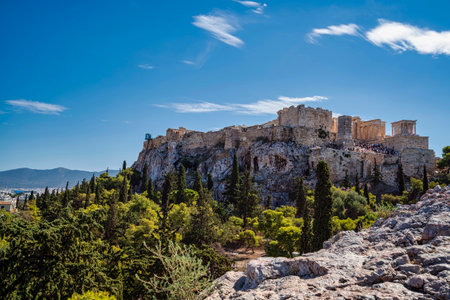 Wide view of the Acropolis in Athens, Greece, showing ancient ruins including the Propylaea and the...