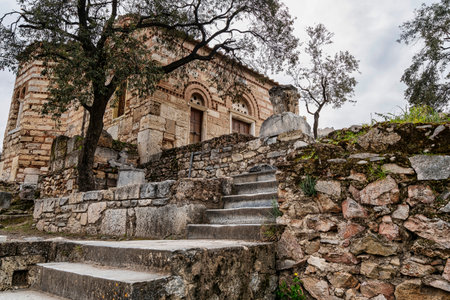 Historic Byzantine Church of the Holy Apostles in the Ancient Agora of Athens, featuring stone masonry, crosses, and aged religious architecture.の写真素材