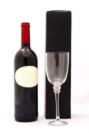 A bottle of delicious South African red wine with glass and black box isolated on white backgroundの写真素材