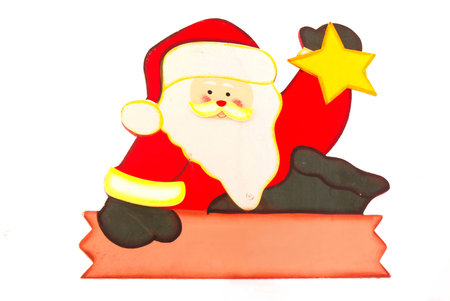 A handmade wooden colorful painted sign of a Santa Claus isolated on white background.の写真素材