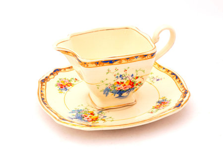 An old English porcelain sugar pot closed with a lid isolated on white backgroundの写真素材