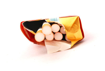 A packet of filter cigarettes shown from front. Isolated on white background.の写真素材