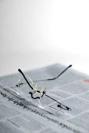 glasses on the newspaperの写真素材