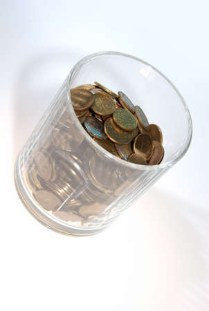 Transparent glass fulfilled of coinの写真素材