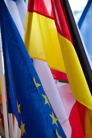 Intenational flags. The flag of European Union is on first plan. The flag of the Germany is from the back.の写真素材