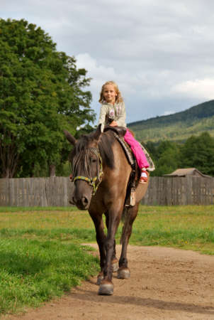 little girl on the horseの写真素材
