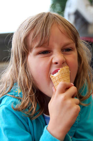 Young girl eating ice-creamの写真素材