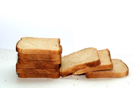 Stack of brown bread isolated on a white backgroundの写真素材