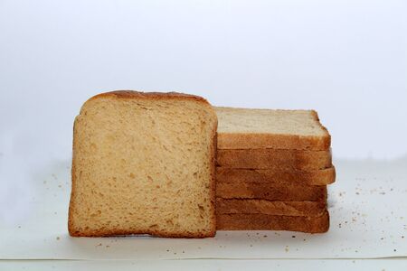 Stack of brown bread isolated on a white backgroundの写真素材
