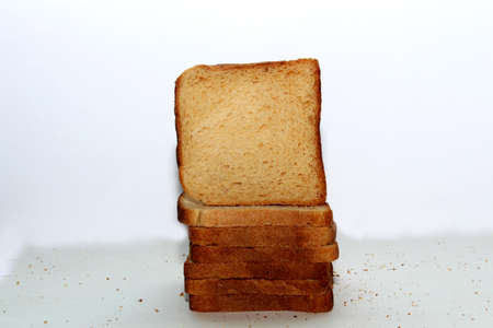 Stack of brown bread isolated on a white backgroundの写真素材