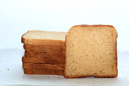 Stack of brown bread isolated on a white backgroundの写真素材