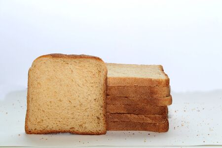 Stack of brown bread isolated on a white backgroundの写真素材