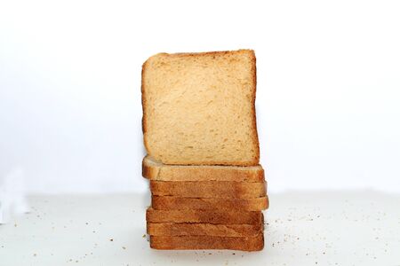 Stack of brown bread isolated on a white backgroundの写真素材