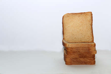 Stack of brown bread isolated on a white backgroundの写真素材