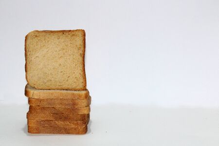 Stack of brown bread isolated on a white backgroundの写真素材