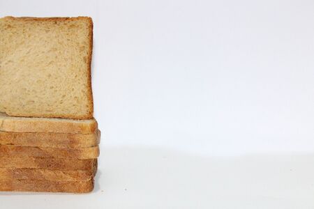 Stack of brown bread isolated on a white backgroundの写真素材