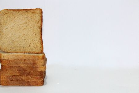 Stack of brown bread isolated on a white backgroundの写真素材