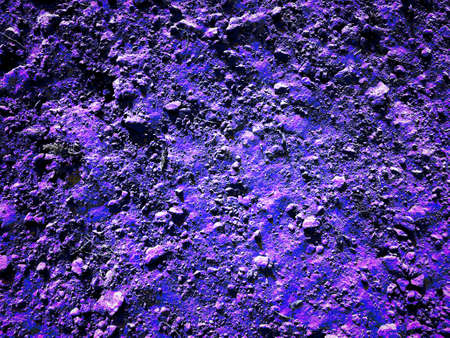 Violet color land texture looking like lunar surface or another planet surface.