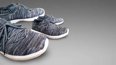 Closeup of big and small size pair of designer shoes of father and son, happy father's day concept