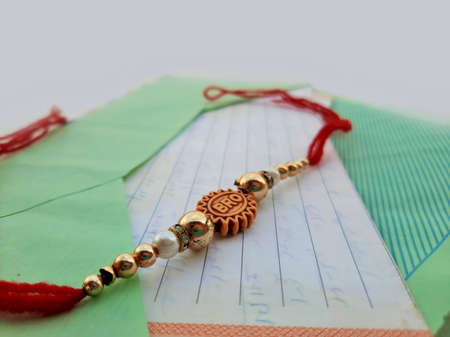 closeup of Rakhee or holy thread with message in envelope on Raksha Bandhan