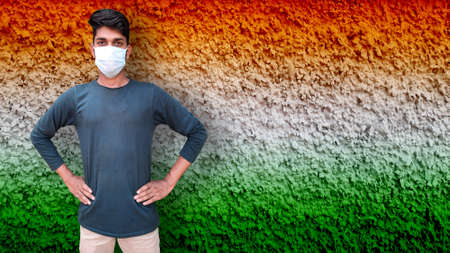 Young male model wearing face mask for corona virus independence day concept
