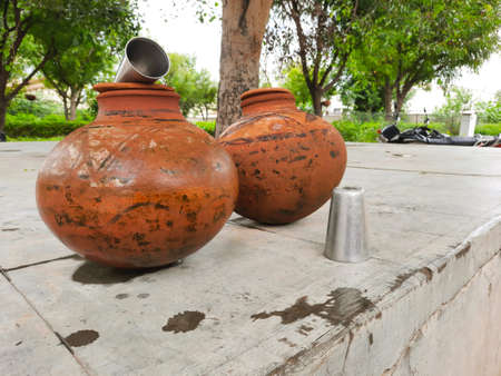 clay pots filled with cool water in summer in Indiaの写真素材