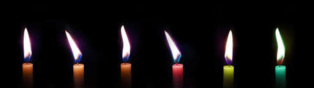 multiple flame and colorful candles isolated in black backgroundの写真素材